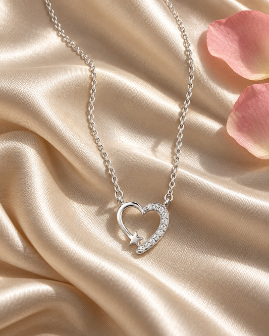 Nova Heart Silver Pendant on cream silk with blush rose petals